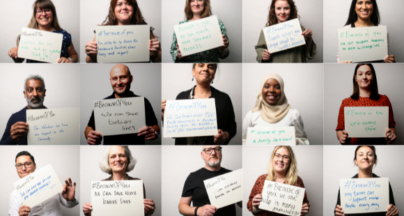 Sands staff holding up whiteboards which read: #BecauseOfYou