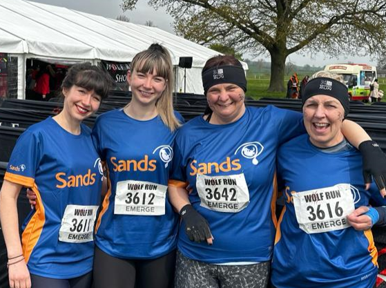 4 ladies in sands t-shirts 