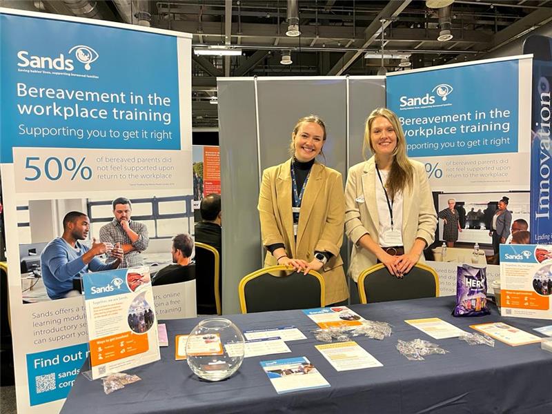 Sands Employees at a conference with Bereavement in the Workplace banners