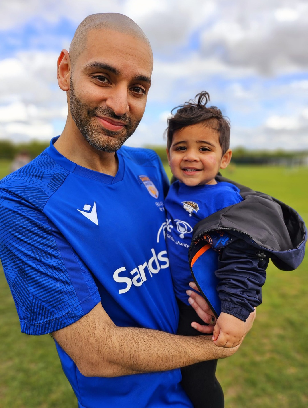 Sands United Nottingham manager Raj Chagger with his second son Ari wearing Sands United kits