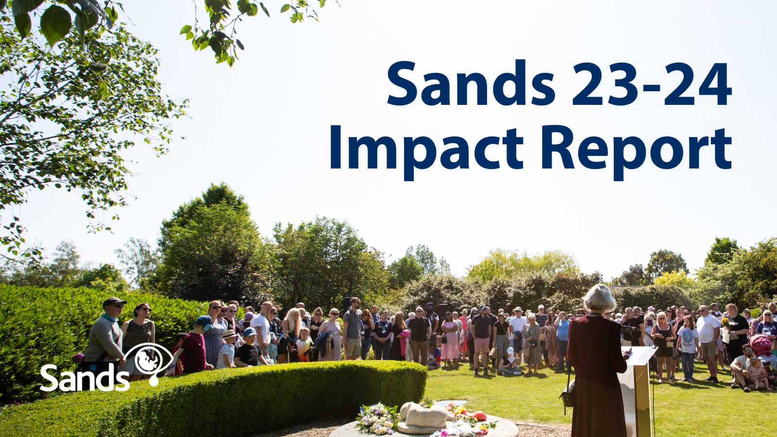 Image of bereaved parents and supporters gathered at the Sands Garden Day memorial service and text Sands Impact Report 2023-24