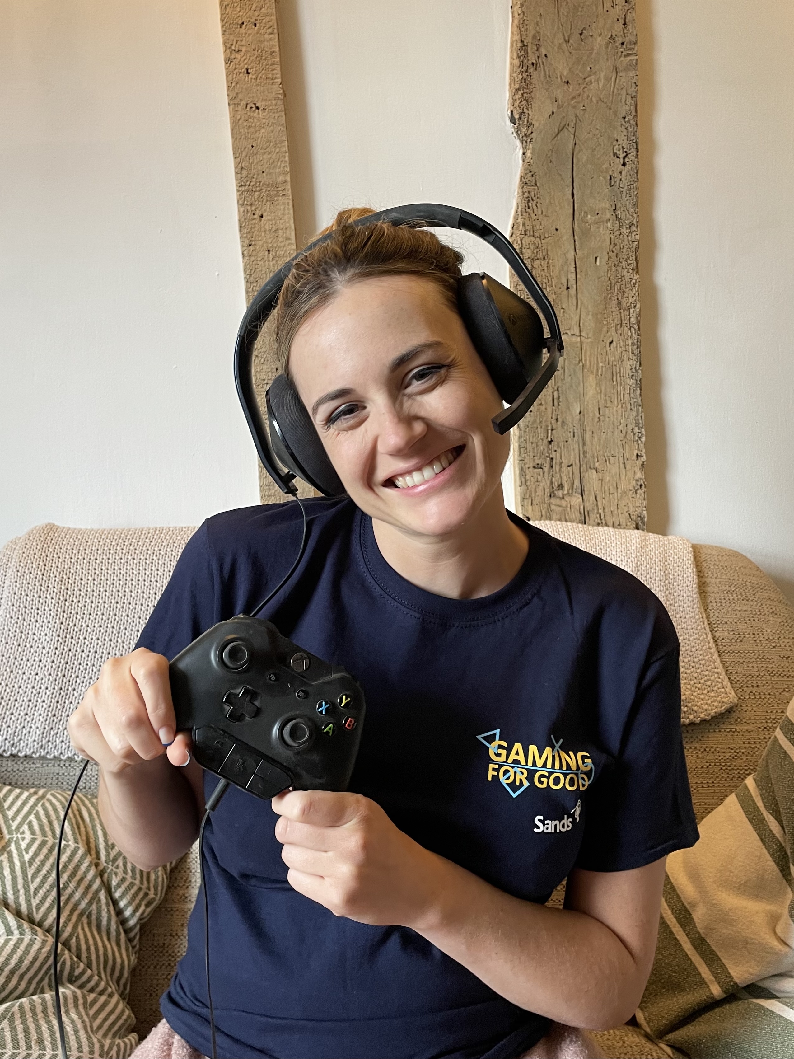 woman with gaming for good t-shirt on