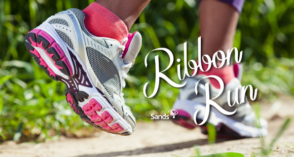 Close up of trainers while someone is running with Ribbon Run logo overlayed