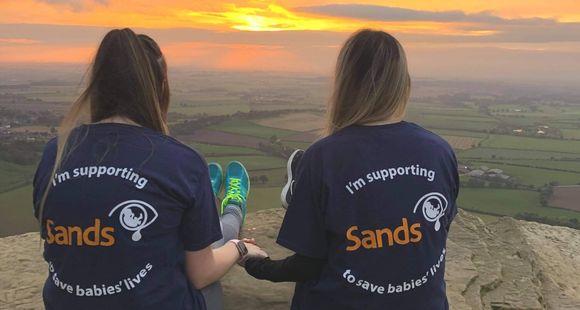 Ladies sat together in their Sands t-shirts