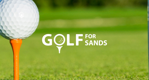 image of a white golf ball on a orange tee along side white 'golf for sands' logo with green grass background