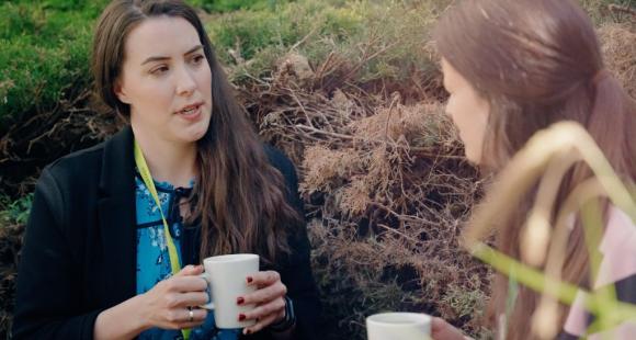Two ladies sat together talking