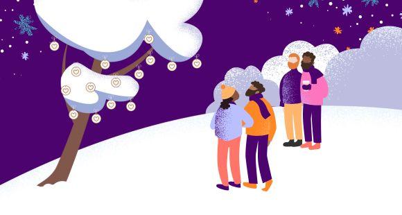 People stood together around a heart with heart decorations