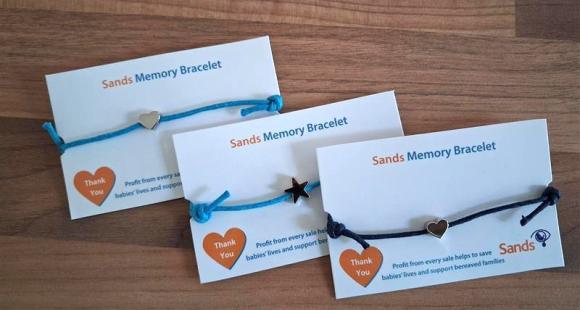 3 blue cord bracelets with heart or star charms