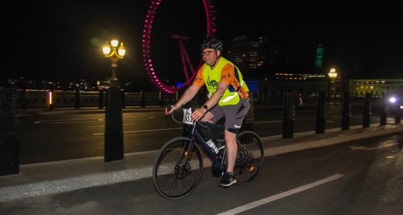 Man cycling at night