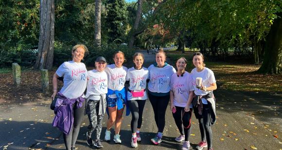Group of women smiling and wearing Ribbon Run t-shirts 