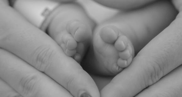 Picture of hands holding baby's feet