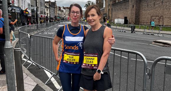 Two female runners posing for a photo