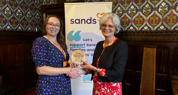 Helen Wilson receives the Elaine Thorp Award for Bereavement Care from Clea Harmer, Chief Executive, Sands