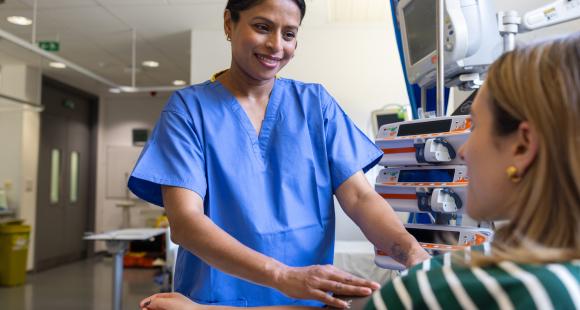 Woman health professional carries out tests on a patient in hospital