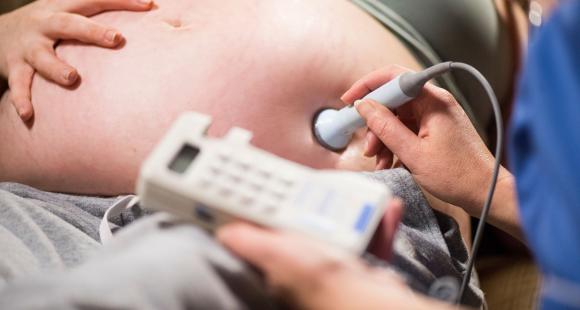 Pregnant woman is examined using a sonogram