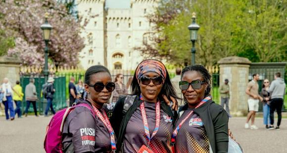 Three women standing in front of Windsor castle.