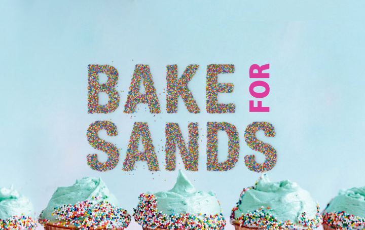 bake for sands logo made from sprinkles above a row of 5 blue cupcakes