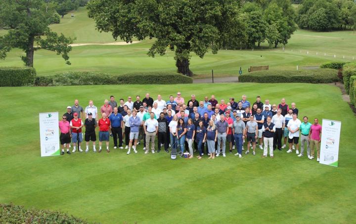 Arial picture of a large group of golfers on the course for a golf day