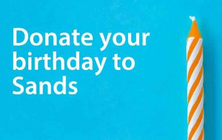 blue background with white text 'donate your birthday to sands' and an orange candle