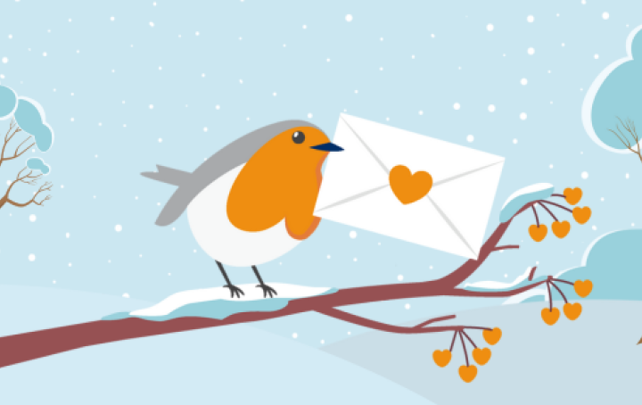 A cartoon robin stands on a branch holding an envelope in it's beak. A winter landscape can be seen in the background