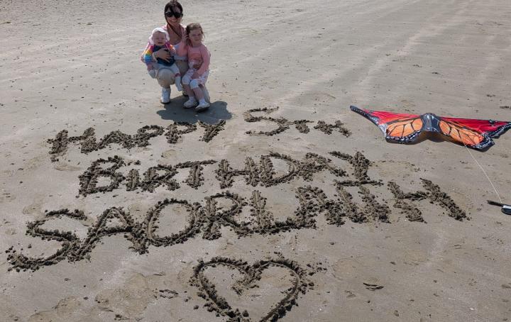 Saorlith's name written in the sand