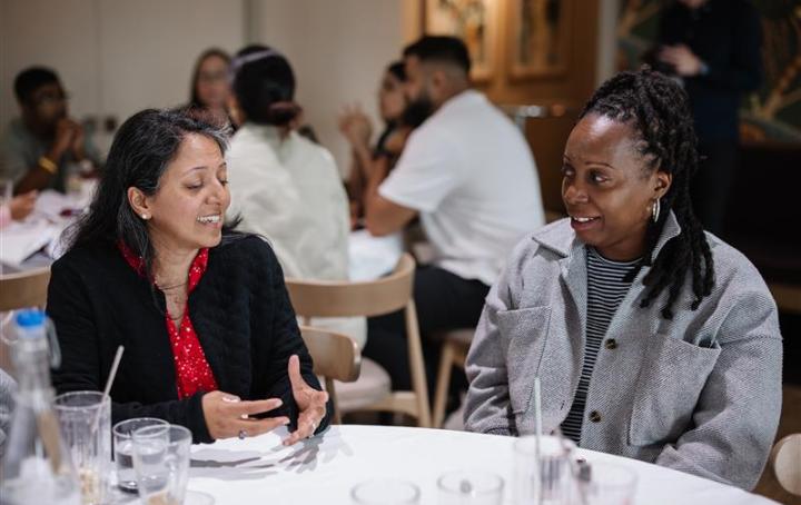 Two ladies sat together talking
