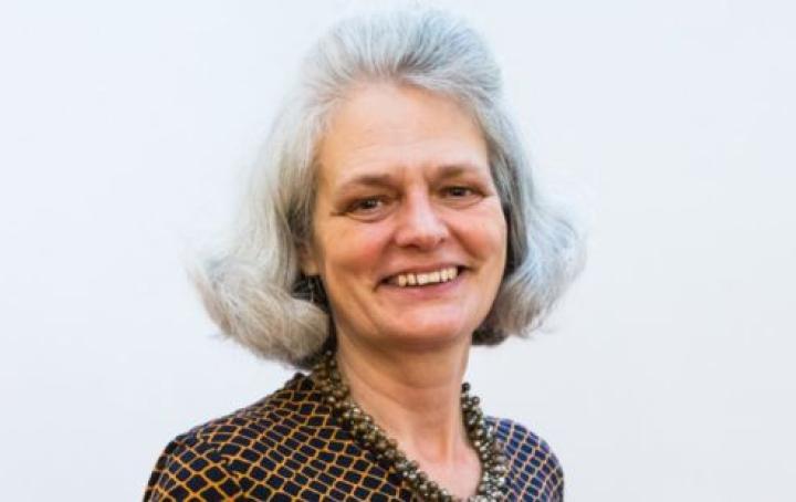 Sands' Chief Executive Clea Harmer is smiling looking at the camera and wearing a diamond print dark brown blouse and brown necklace