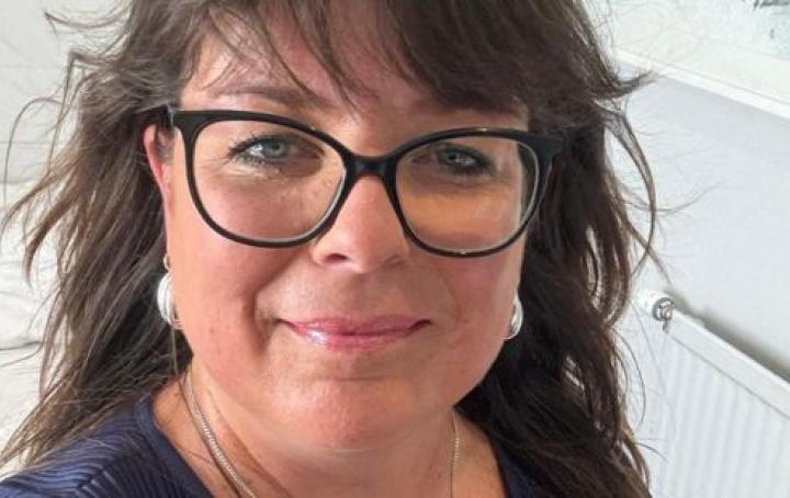 Carolyn smiling at the camera