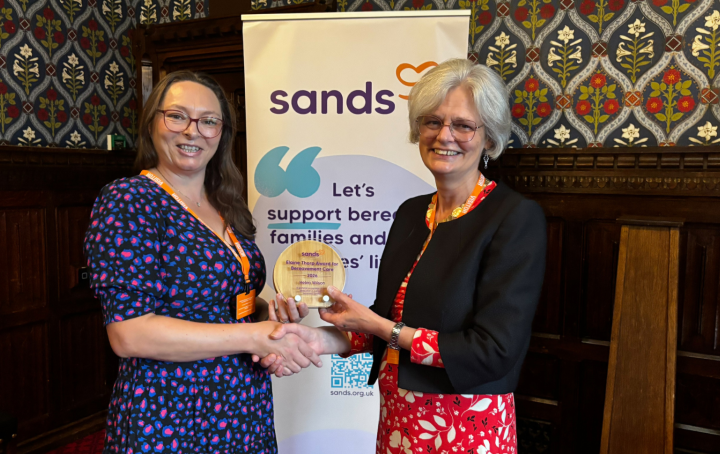 Helen Wilson receives the Elaine Thorp Award for Bereavement Care from Clea Harmer, Chief Executive, Sands