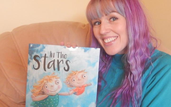 Sam Kitson with her book "In the Stars"