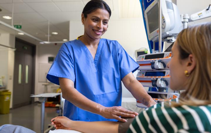 Woman health professional carries out tests on a patient in hospital