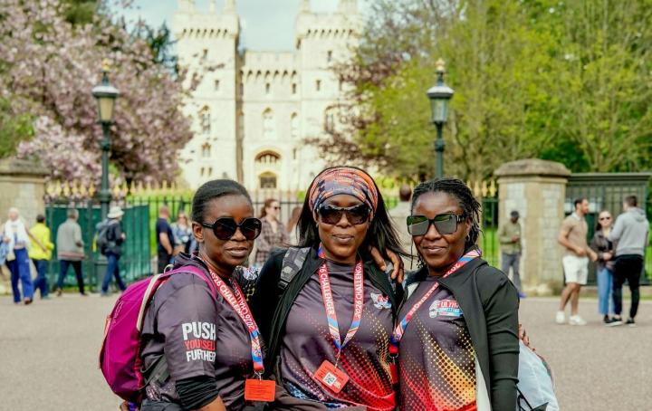 Three women standing in front of Windsor castle.